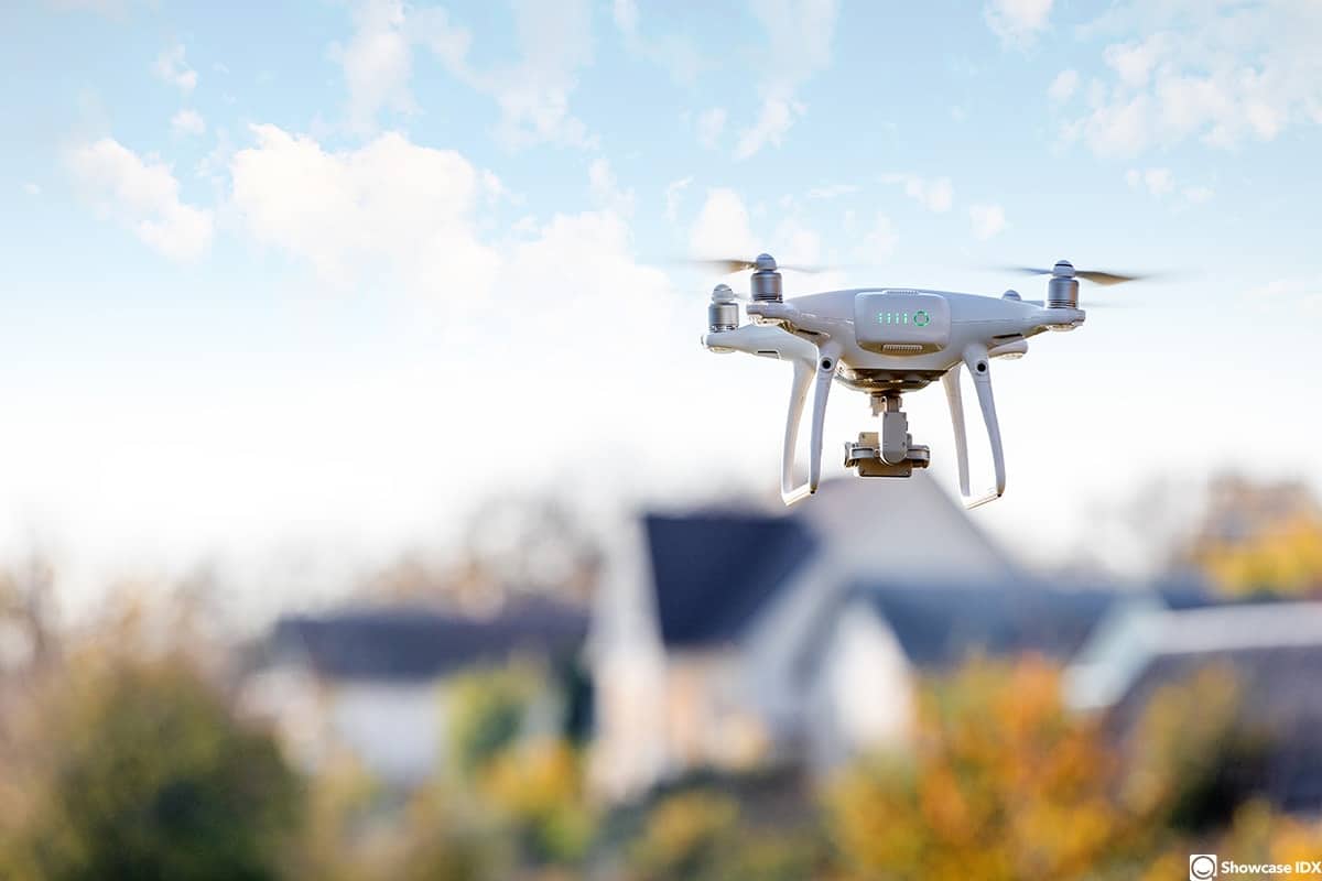 real estate marketing materials drone flying front of home